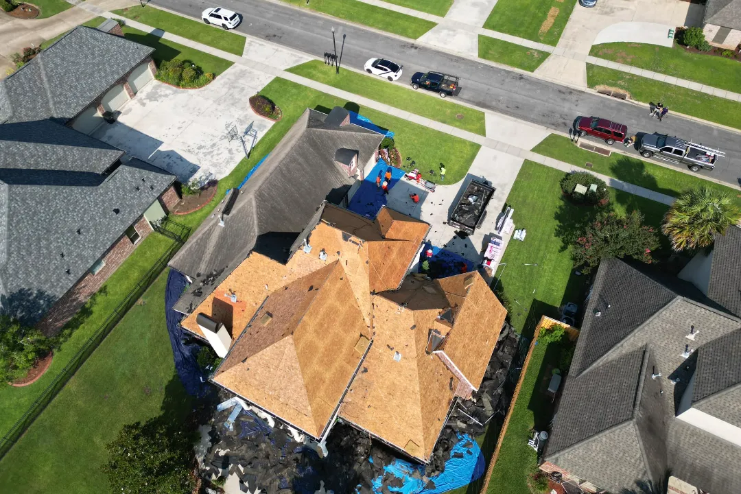 overhead rear drone view McIntyre Family Residence Owens Corning Duration Driftwood Roofing before crews tearing off old roof