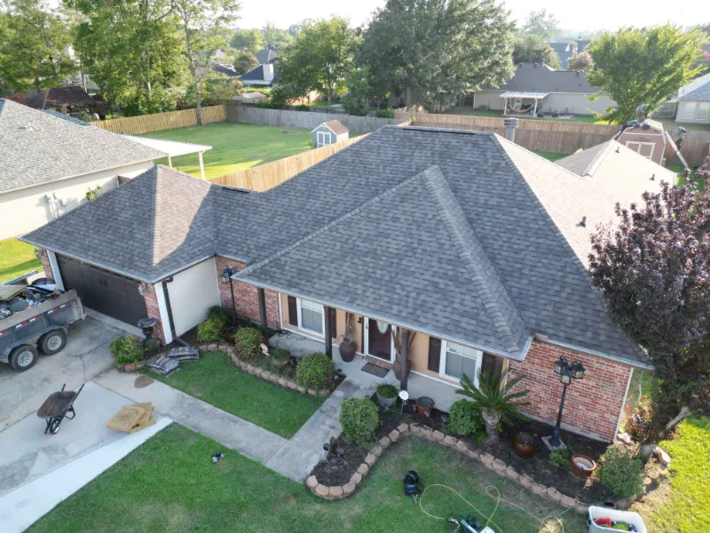 after mathers house front drone overhead shingles complete